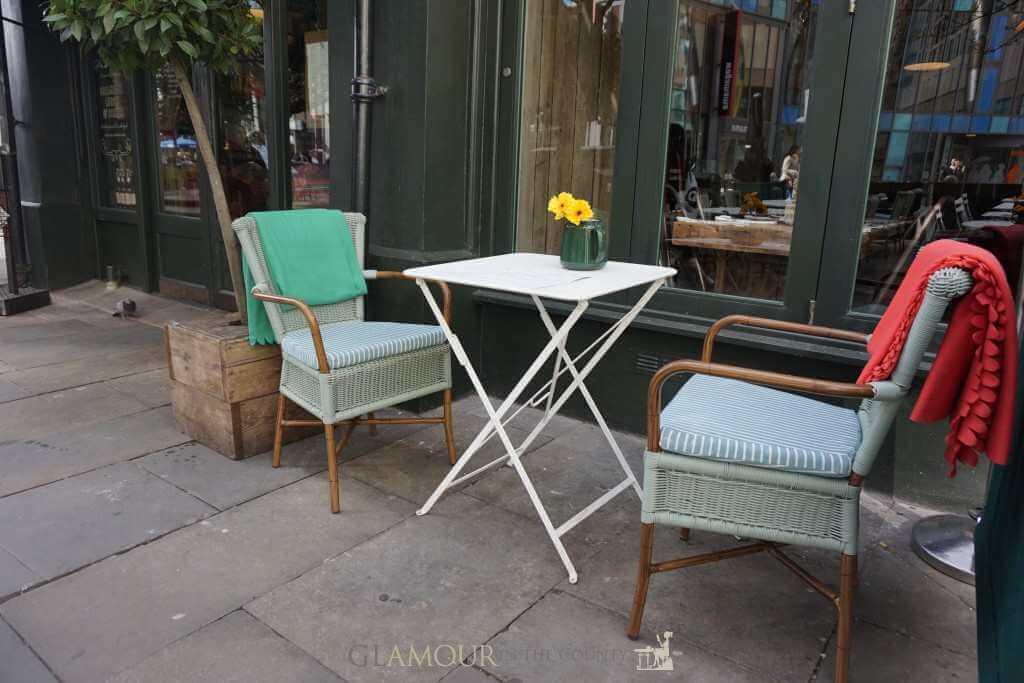 a lazy weekend - two chairs and table outside a restaurant